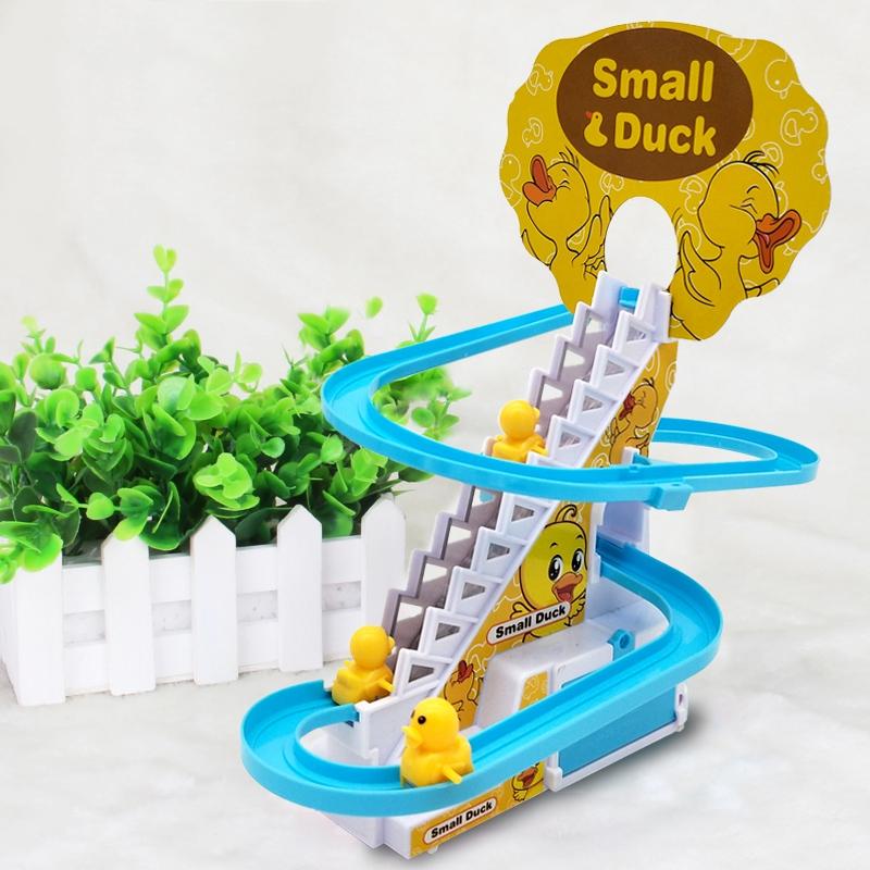 Side view of electric duck climbing stairs track toy for children